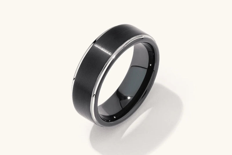Black ring with a reflective surface on a white background