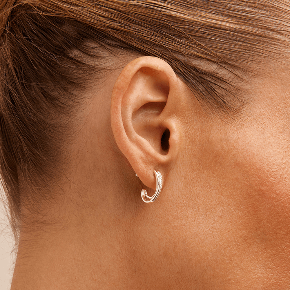 Crossover Huggie Earrings with 0.10tw of Laboratory-Grown Diamonds in Sterling Silver and Platinum Earrings Bevilles 