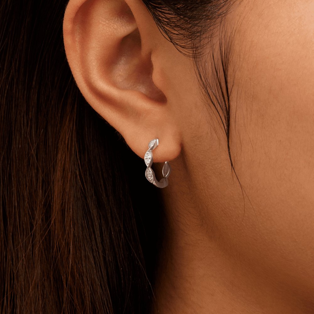 Twist Huggie Earrings with 0.10tw of Laboratory-Grown Diamonds in Sterling Silver and Platinum Earrings Bevilles 