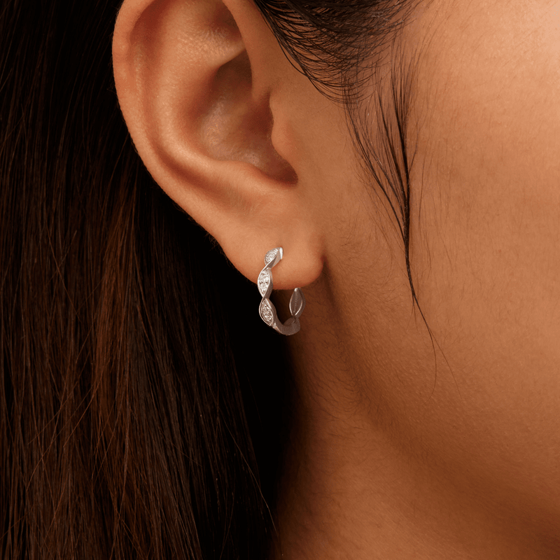 Twist Huggie Earrings with 0.10tw of Laboratory-Grown Diamonds in Sterling Silver and Platinum Earrings Bevilles 