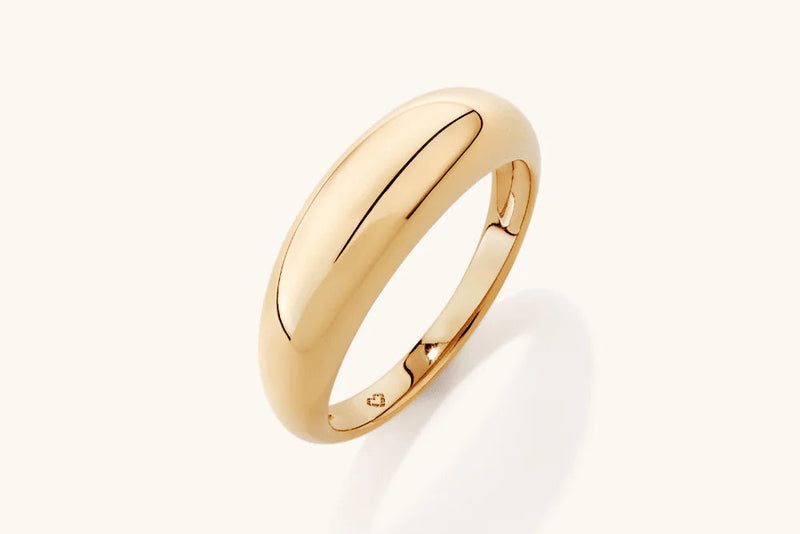 Gold ring on a white background
