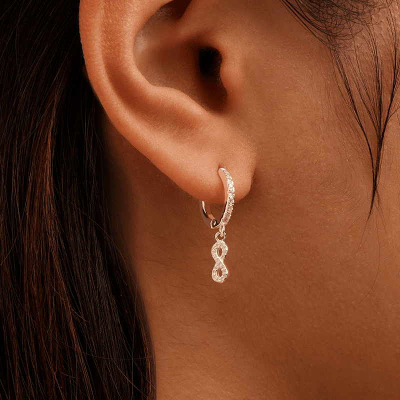 Cubic Zirconia Infinity Charm Huggie Earrings in Sterling Silver Earrings Bevilles 