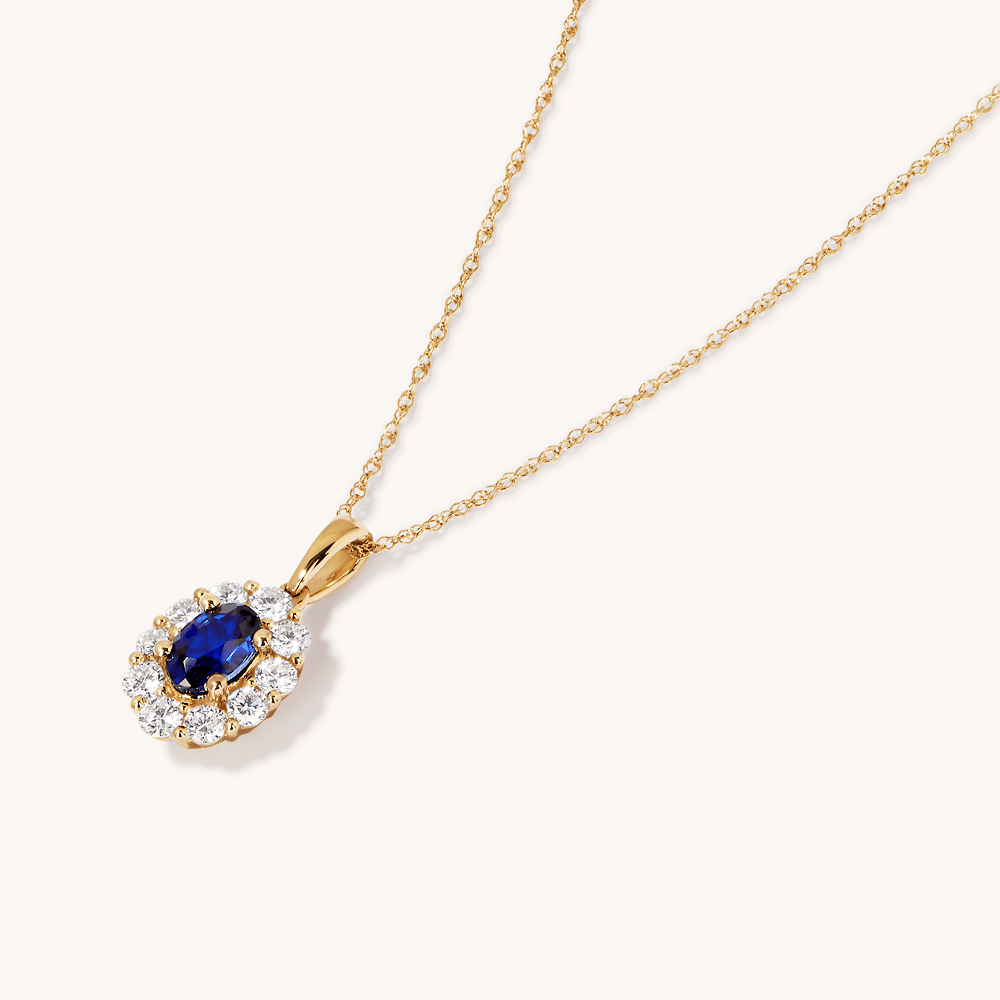 45cm Oval Created Sapphire Halo Pendant Necklace with 0.46tw of Laboratory-Grown Diamonds in 9kt Yellow Gold Pendants Bevilles 