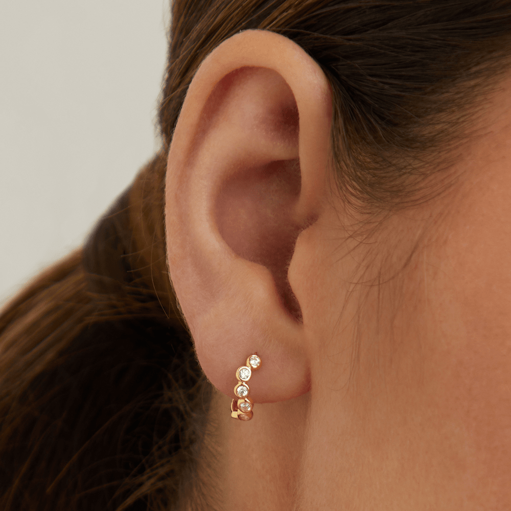 Cubic Zirconia Wave Huggie Earrings in 9kt Yellow Gold Earrings Bevilles 