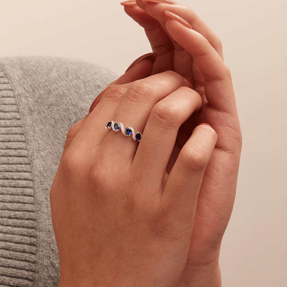 Oval Created Sapphire Swirl Ring with 0.14tw of Laboratory-Grown Diamonds in Sterling Silver and Platinum Rings Bevilles 