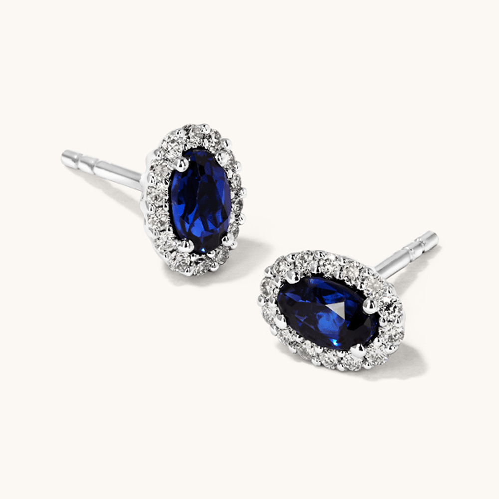 Oval Created Sapphire Halo Stud Earrings with 0.14tw of Laboratory-Grown Diamonds in Sterling Silver and Platinum Earrings Bevilles 