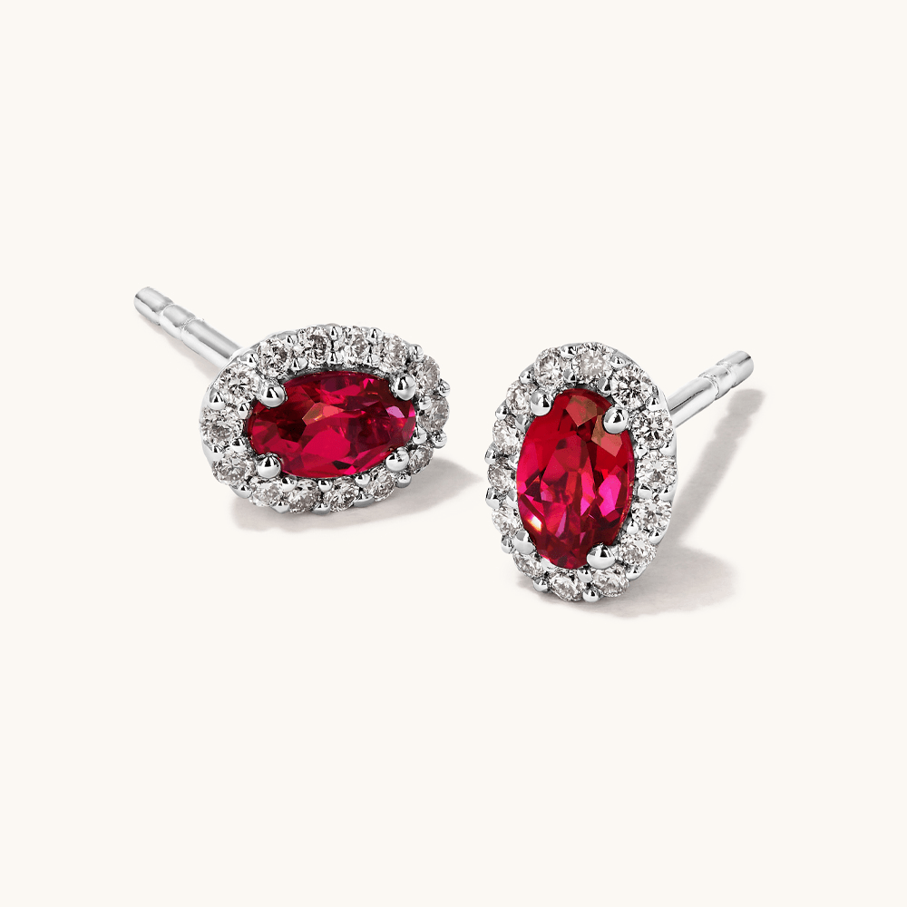Oval Created Ruby Halo Stud Earrings with 0.14tw of Laboratory-Grown Diamonds in Sterling Silver and Platinum Earrings Bevilles 
