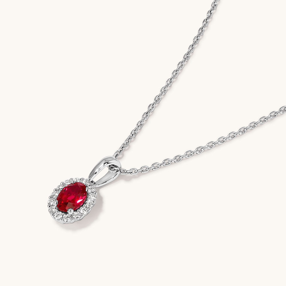 45cm Oval Created Ruby Halo Pendant Necklace with 0.13tw of Laboratory-Grown Diamonds in Sterling Silver and Platinum Pendants Bevilles 