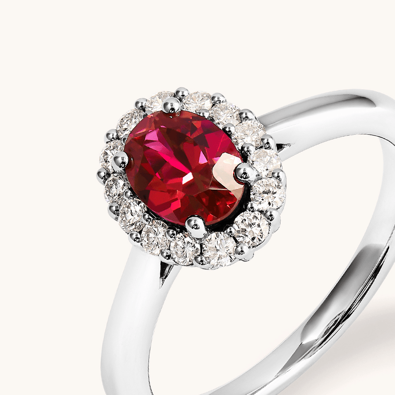 Oval Created Ruby Halo Ring with 0.23tw of Laboratory-Grown Diamonds in Sterling Silver and Platinum Rings Bevilles 