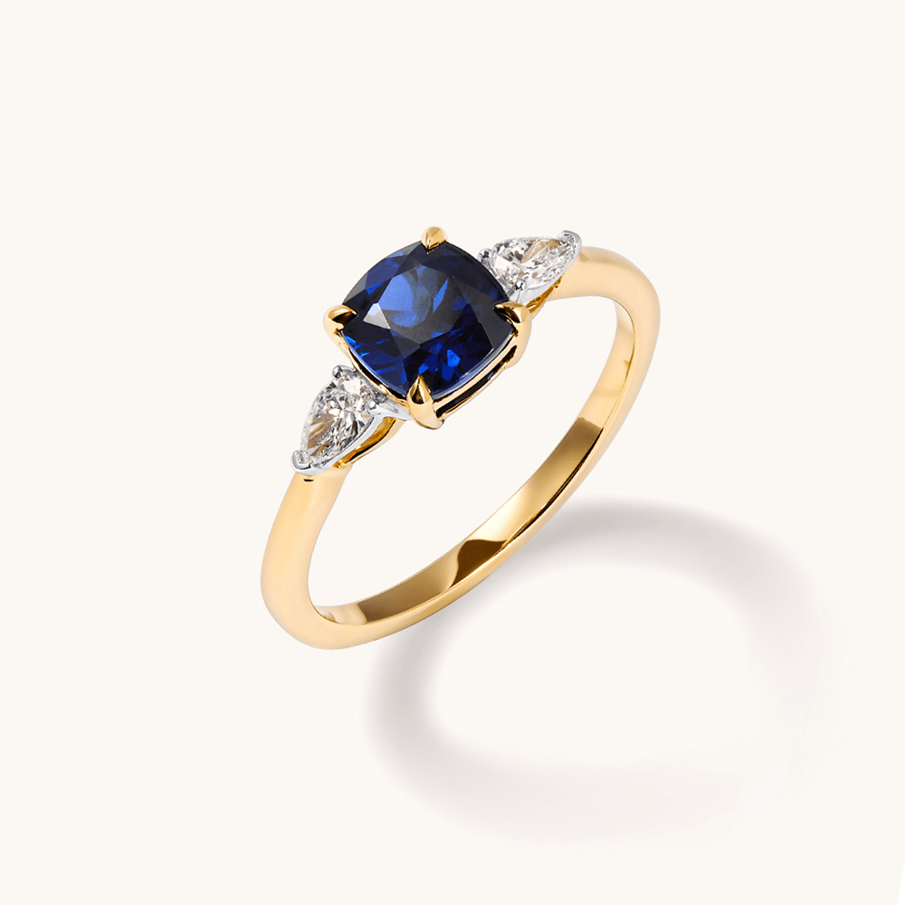 Three Stone Ring with Created Sapphire and 0.20tw of Laboratory-Grown Diamonds in 9kt Yellow Gold Rings Bevilles 