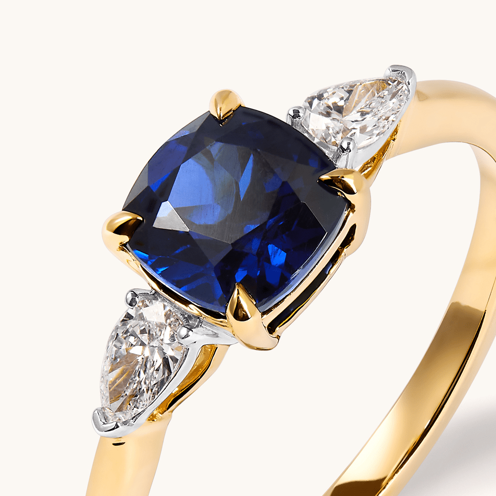 Three Stone Ring with Created Sapphire and 0.20tw of Laboratory-Grown Diamonds in 9kt Yellow Gold Rings Bevilles 