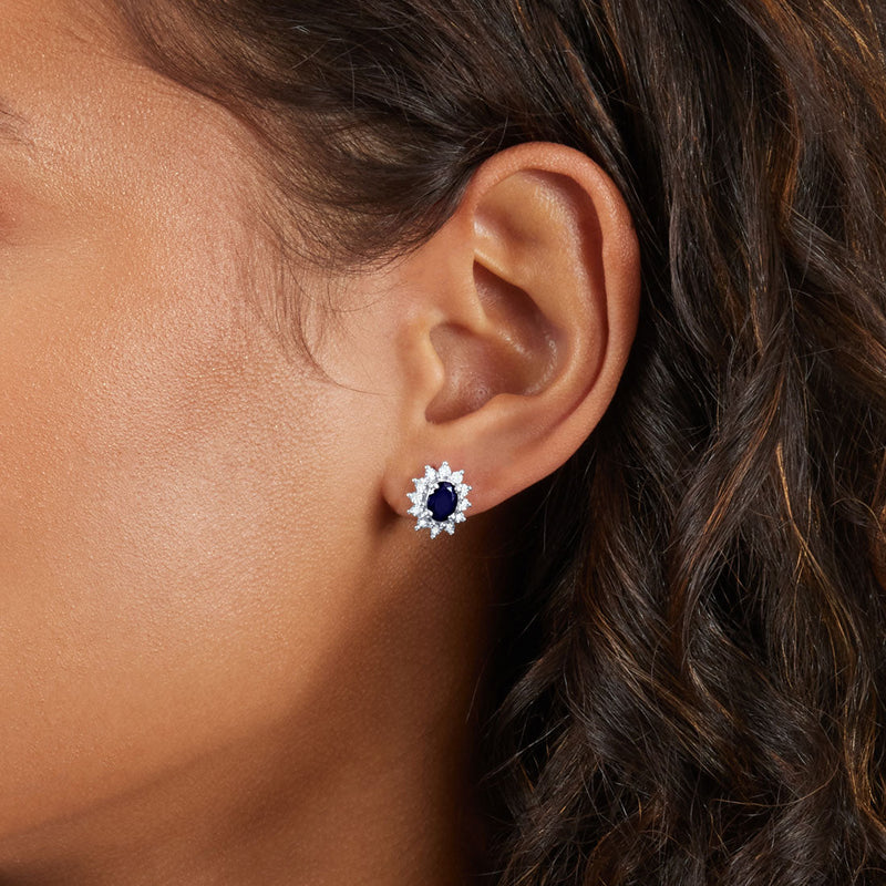 Oval Created Sapphire Stud Earrings with 0.10ct of Diamonds in Sterling Silver Earrings Bevilles 